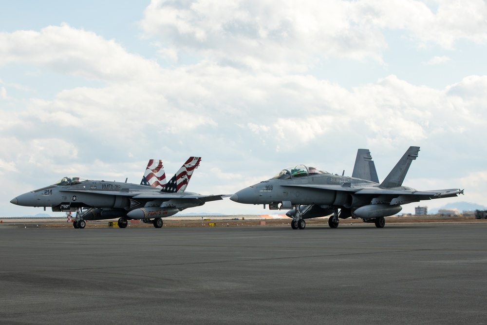 U.S. Marine is rewarded for their hard work with a ride in an F/A-18