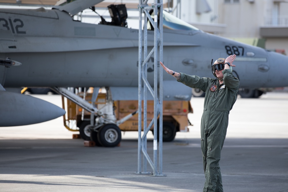 U.S. Marine is rewarded for their hard work with a ride in an F/A-18