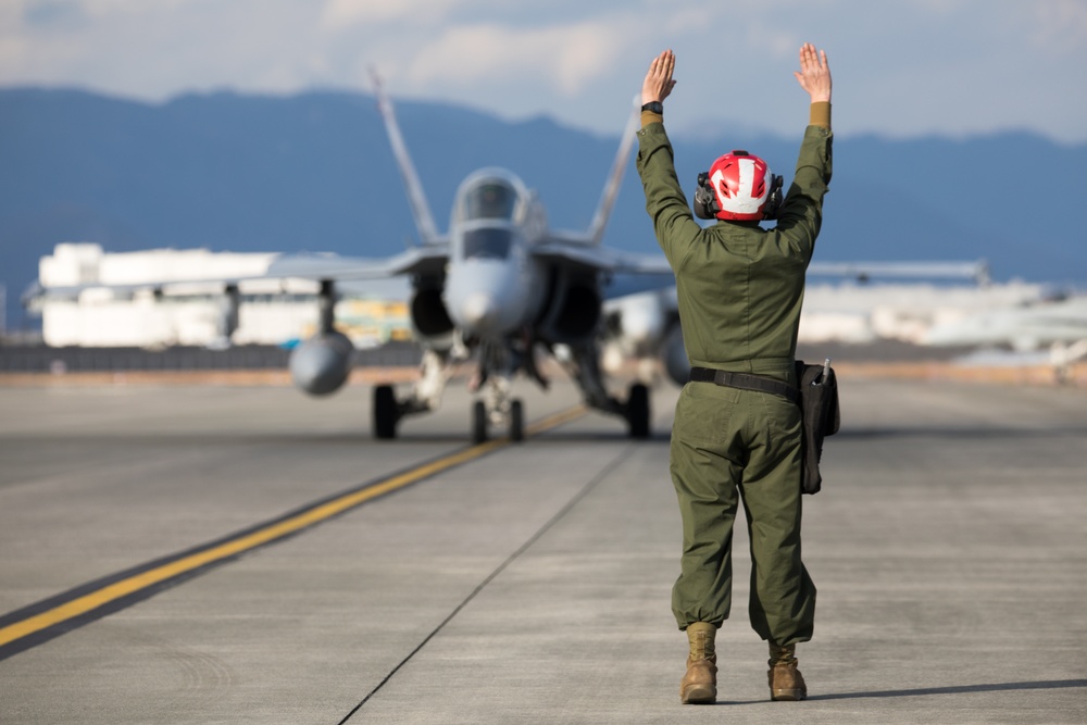 U.S. Marine is rewarded for their hard work with a ride in an F/A-18