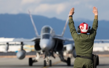 U.S. Marine is rewarded for their hard work with a ride in an F/A-18