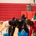 Volunteers pack gift bags for Holidays in the Barracks event