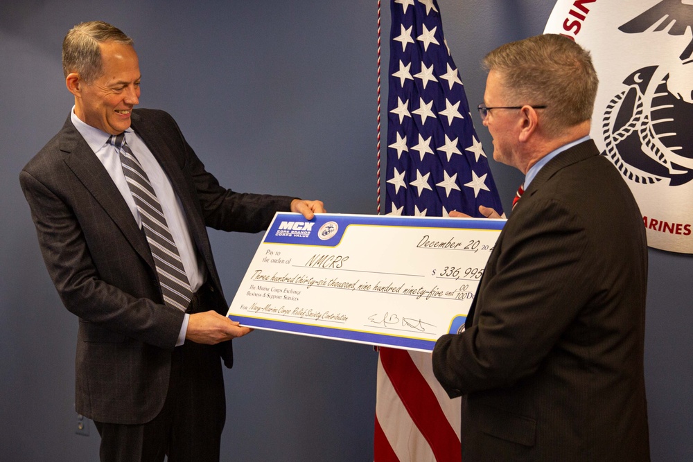 Navy-Marine Corps Relief Society receives check from Business and Support Services Division