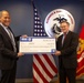 Navy-Marine Corps Relief Society receives check from Business and Support Services Division