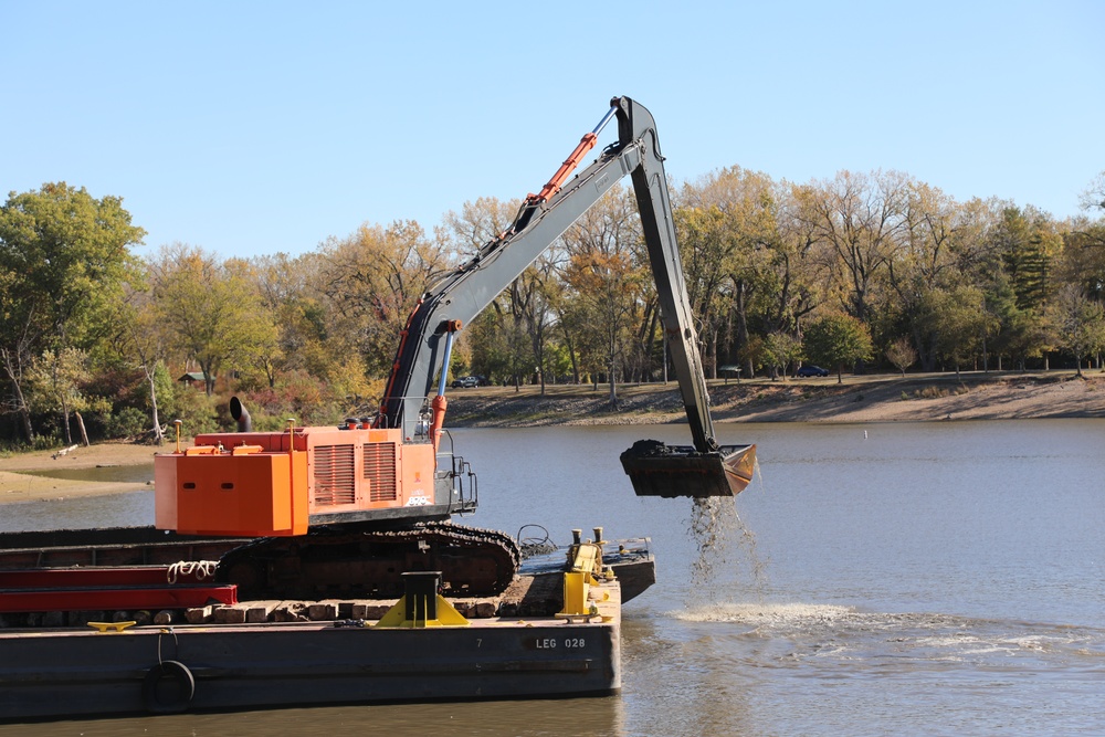 Bucket loader dredging the Sunset Marina