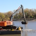 Bucket loader dredging the Sunset Marina