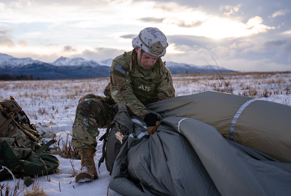 2nd Infantry Brigade, 11th Airborne Division Soldiers conducted a winter jump into Malamute DZ