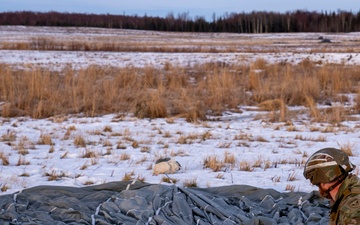 2nd Infantry Brigade, 11th Airborne Division Soldiers conducted a winter jump into Malamute DZ