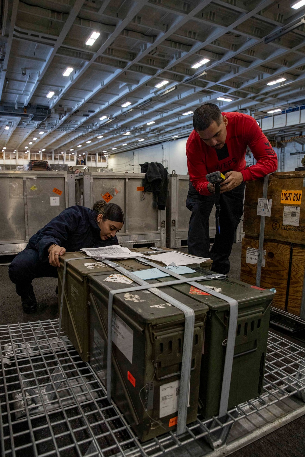 USS Abraham Lincoln conducts ammunition transfer with USNS Washington Chambers