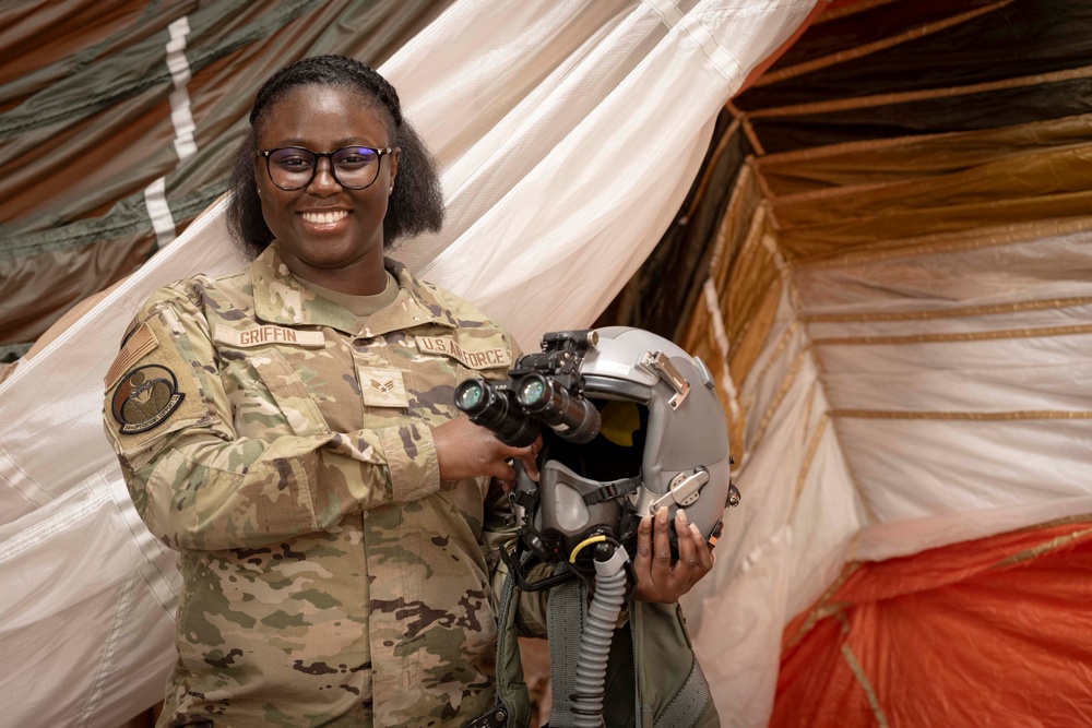 Aircrew member of the 54th OSS ensures safe flight operations