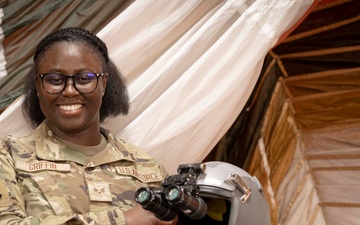 Aircrew member of the 54th OSS ensures safe flight operations