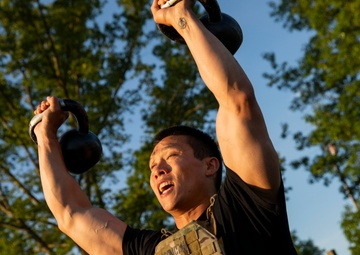 Participants of the 11th Annual Best Combat Camera Competition compete in an event testing their physical fitness.