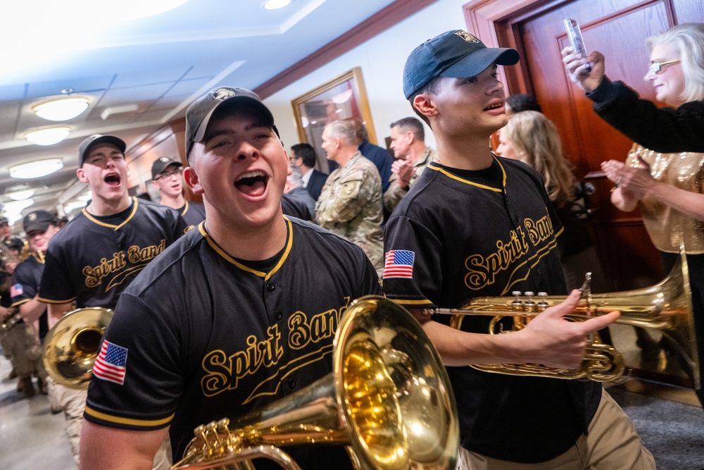 Members of the U.S. Military Academy at West Point Spirit Band stop by the office of the Honorable Christine Wormuth, Secretary of the Army, during the Army Spirit Rally