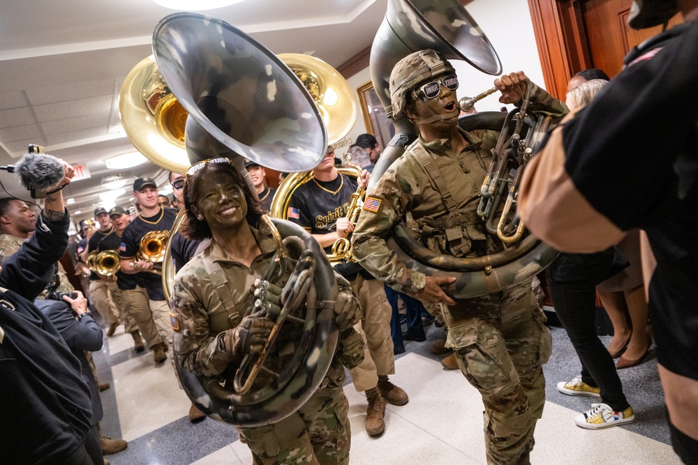 Members of the U.S. Military Academy at West Point Spirit Band stop by the office of the Honorable Christine Wormuth, Secretary of the Army, during the Spirit Rally