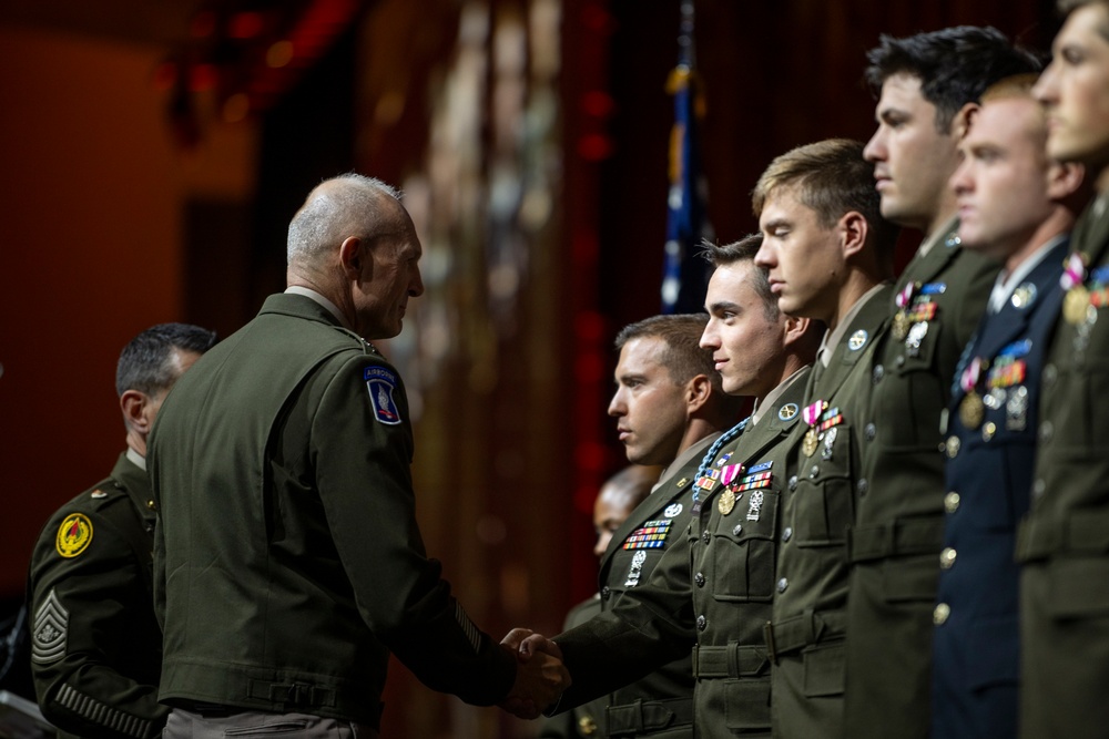 Winners of the U.S. Army's Best Squad Competition are awarded by Gen. Randy A. George, Chief of Staff, during Association of the United States Army (AUSA) Annual Meeting and Exposition