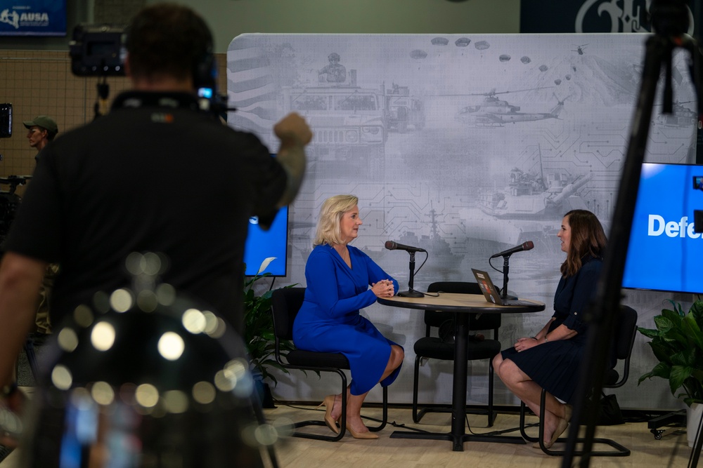 Secretary of the Army, Hon. Christine Wormuth, speaks to a reporter with Defense One before her floor walk during the 2024 Association of the U.S. Army Annual Meeting and Exposition