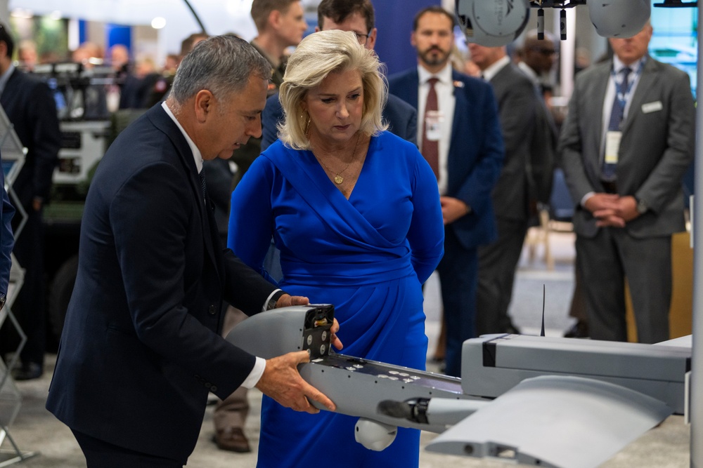 Secretary of the Army, Hon. Christine Wormuth reviews military equipment during the 2024 Association of the U.S. Army Annual Meeting and Exposition