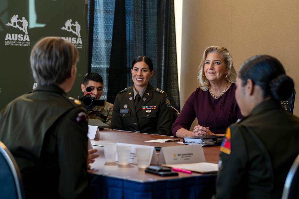 Secretary of the Army Hon. Christine Wormuth, is briefed on the experiences of U.S. Army Capt. Samantha Buffet and other U.S. Army social media influencers during the 2024 Association of the U.S. Army Annual Meeting and Exposition
