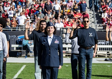 Recruits swear into the U.S. Air Force during the 2024 Lockheed Martin Armed Forces Bowl
