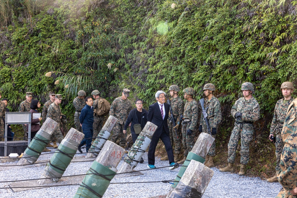 MCIPAC commanding general tours Jungle Warfare Training Center with Government of Japan officials