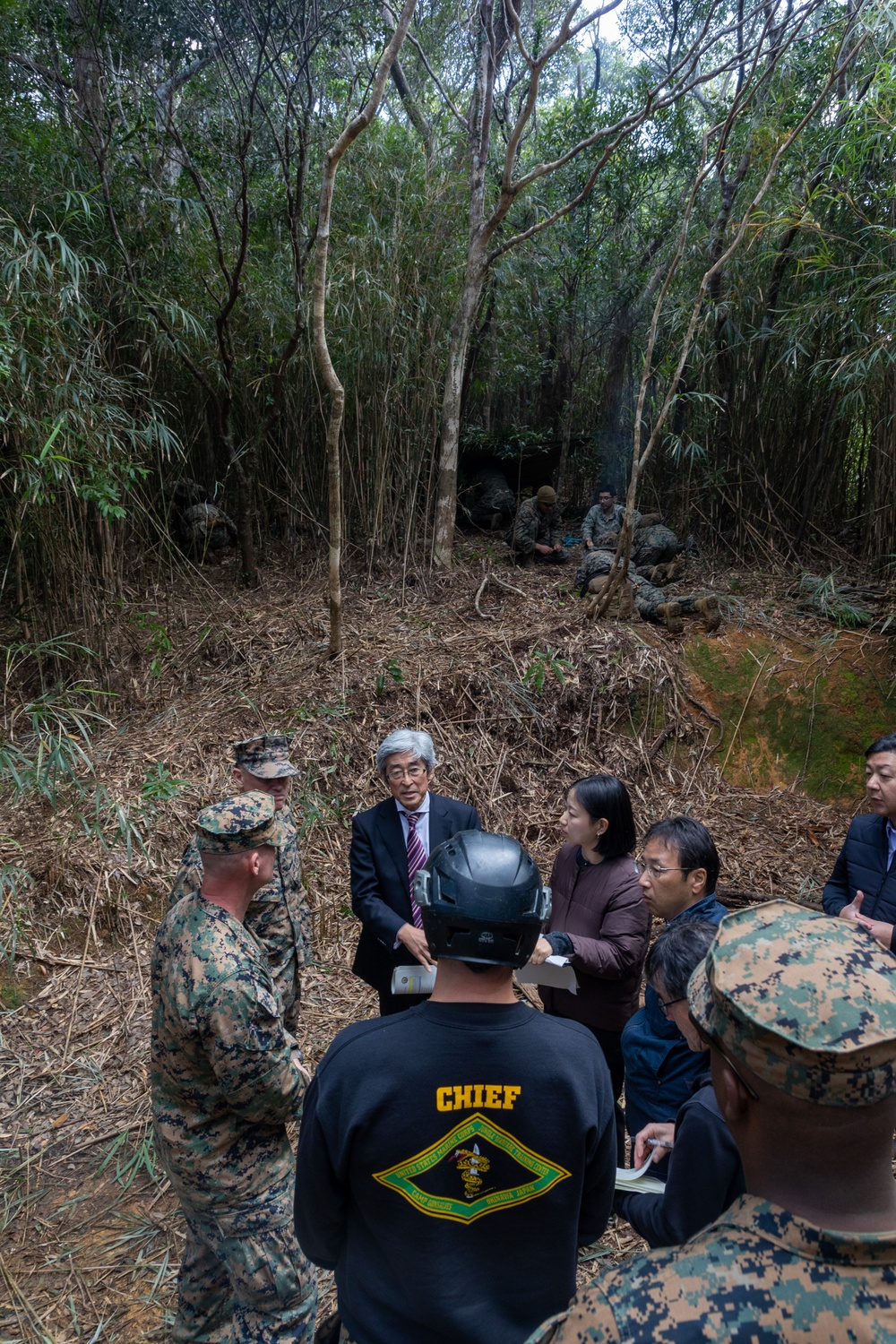 MCIPAC commanding general tours Jungle Warfare Training Center with Government of Japan officials