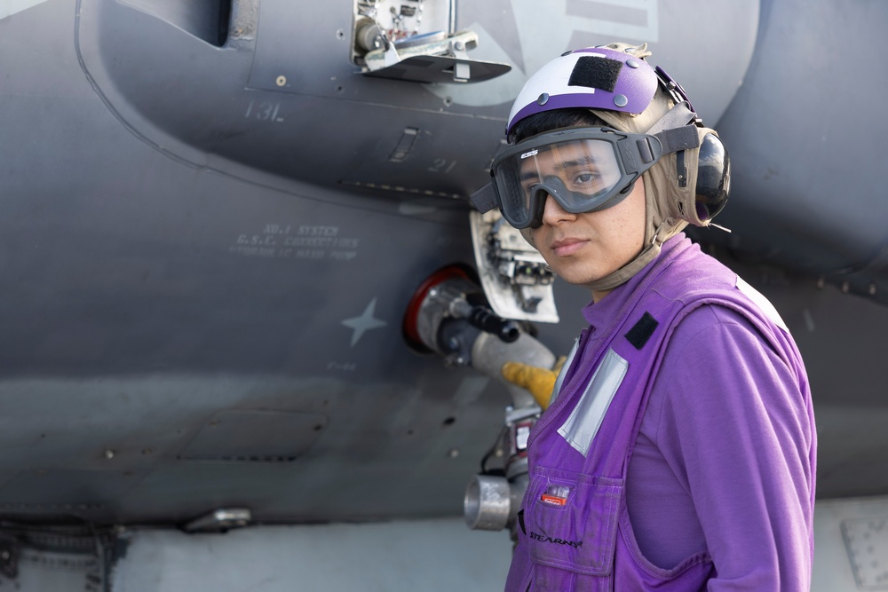 Airman Refuels Harrier