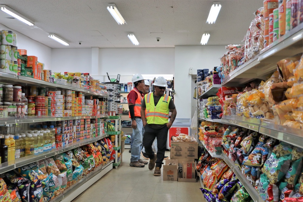 Safety personnel examine a store for H-2B visa workers at a contractor-owned facility