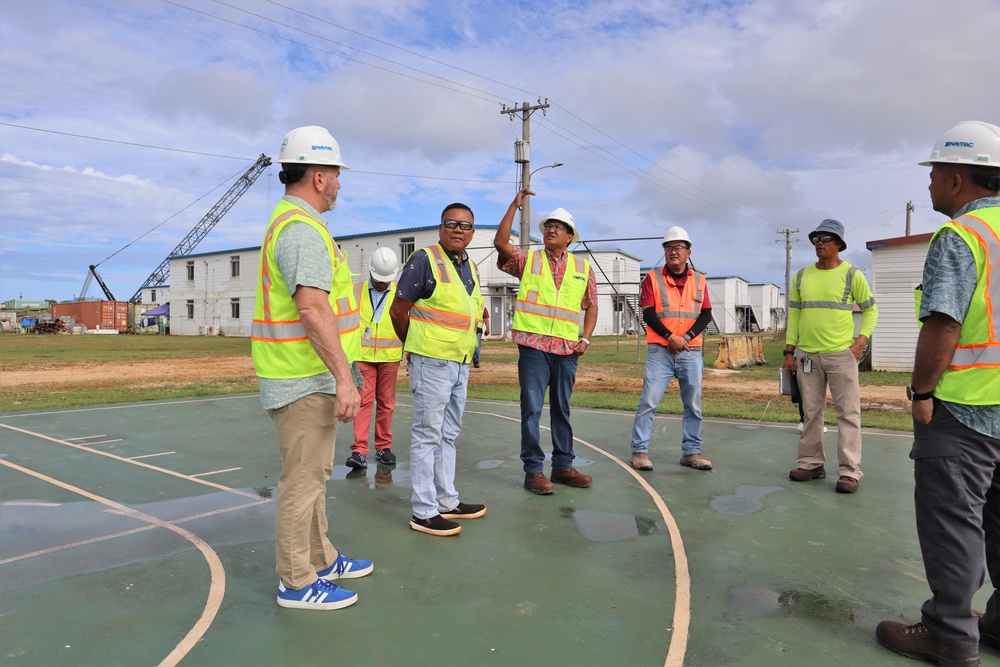 Safety personnel inspect a basketball court for H-2B visa workers on contractor-owned facilities