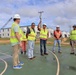 Safety personnel inspect a basketball court for H-2B visa workers on contractor-owned facilities