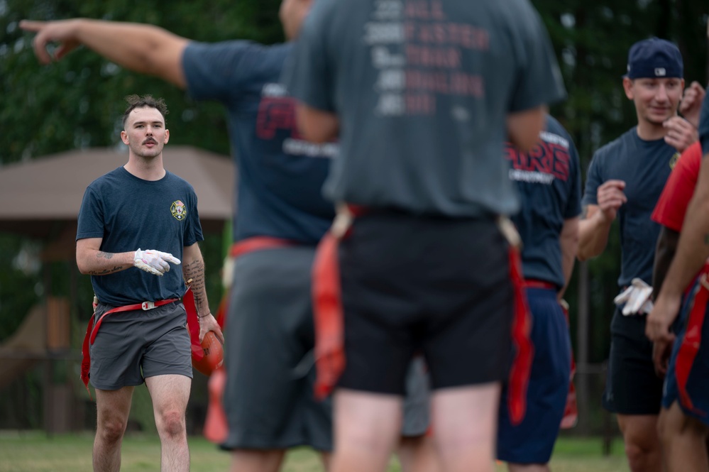 Airman approaches his teammates
