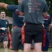 Airman approaches his teammates