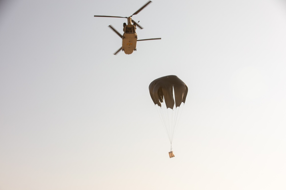 A CH-47 Drops an MRE Pallet During LCLA Operations