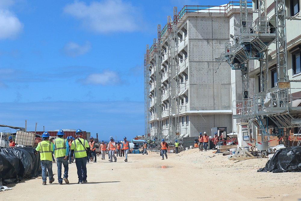 Construction workers working on Marine Corps Base Camp Blaz head to lunch