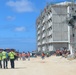 Construction workers working on Marine Corps Base Camp Blaz head to lunch