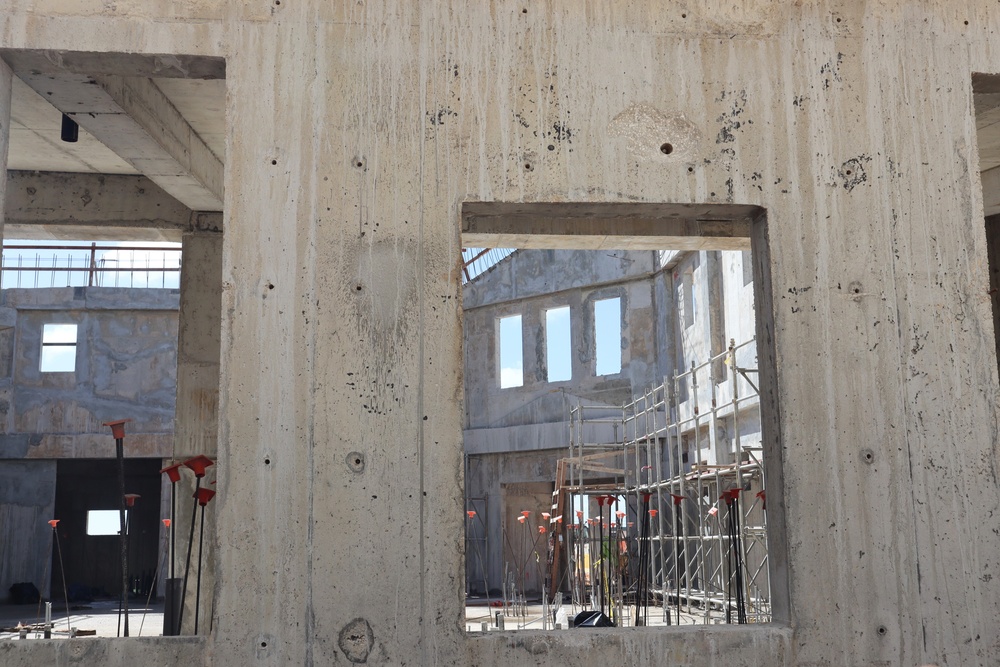 Rebar can be seen within the envelope of an unfinished community center on Marine Corps Base Camp Blaz