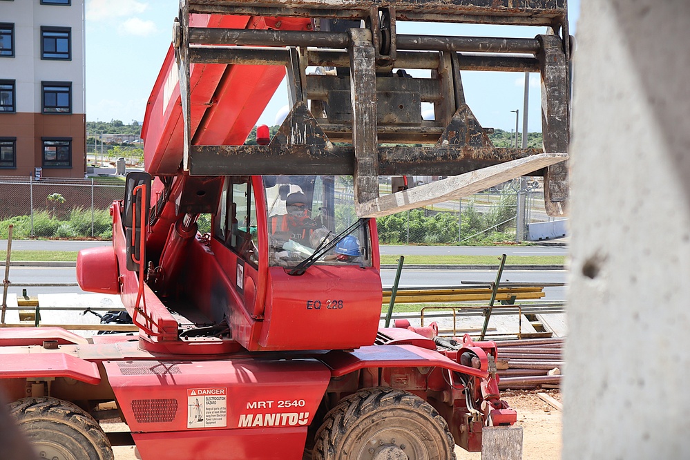 The operator of a telescopic forklift is seen conducting work on Marine Corps Base Camp Blaz in January 2025