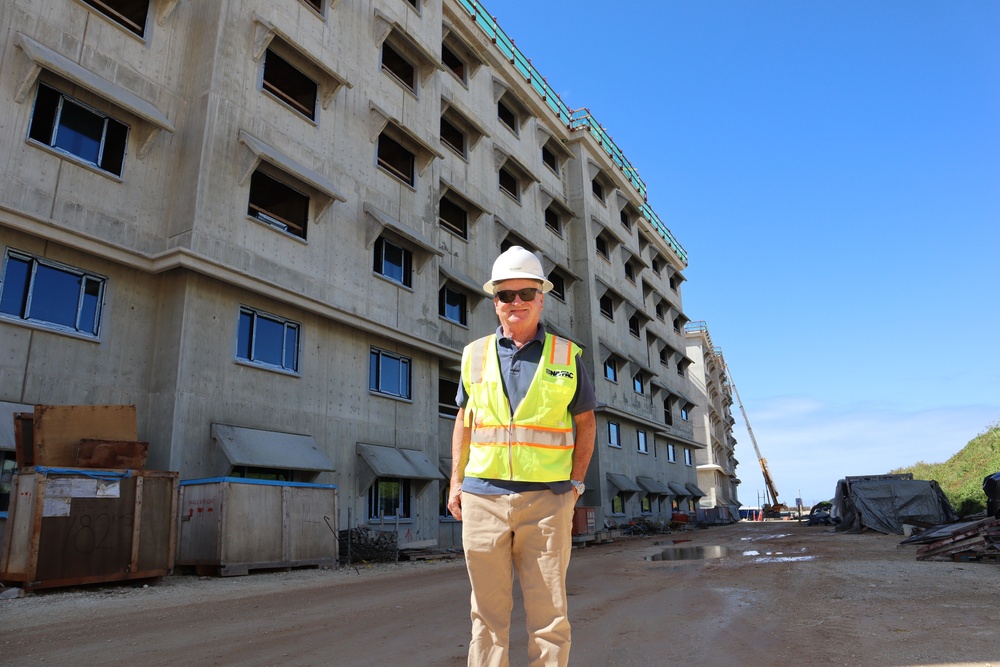 An Engineering Technician poses in front of his project on Marine Corps Base Camp Blaz