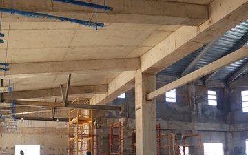 Contractors make progress on a community center under construction on Marine Corps Base Camp Blaz