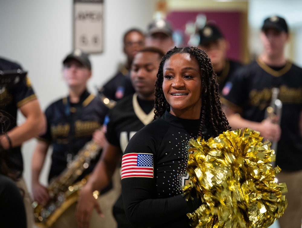 Members of the U.S. Military Academy at West Point Spirit Band stop by the office of Hon. Christine Wormuth, Secretary of the Army, during the Spirit Rally
