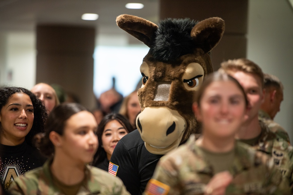 Members of the U.S. Military Academy at West Point Spirit Band stop by the office of Hon. Christine Wormuth, Secretary of the Army, during the Spirit Rally