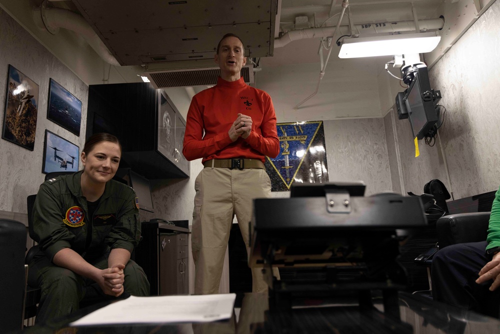 Sailors Assigned to Helicopter Sea Combat Squadron (HSC) 4 speak on the phone with the Chief of Naval Operations, Adm. Lisa Franchetti Aboard USS Carl Vinson (CVN 70)