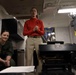 Sailors Assigned to Helicopter Sea Combat Squadron (HSC) 4 speak on the phone with the Chief of Naval Operations, Adm. Lisa Franchetti Aboard USS Carl Vinson (CVN 70)