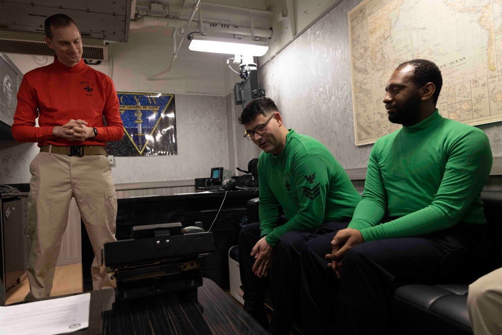 Sailors Assigned to Helicopter Sea Combat Squadron (HSC) 4 speak on the phone with the Chief of Naval Operations, Adm. Lisa Franchetti Aboard USS Carl Vinson (CVN 70)