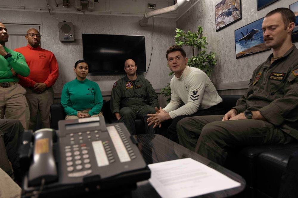 Sailors Assigned to Helicopter Sea Combat Squadron (HSC) 4 speak on the phone with the Chief of Naval Operations, Adm. Lisa Franchetti Aboard USS Carl Vinson (CVN 70)