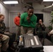 Sailors Assigned to Helicopter Sea Combat Squadron (HSC) 4 speak on the phone with the Chief of Naval Operations, Adm. Lisa Franchetti Aboard USS Carl Vinson (CVN 70)