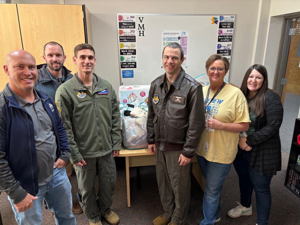 719th Test Squadron deliver gifts to local families