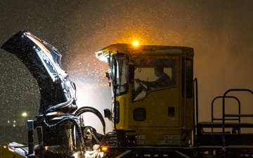The quiet heroes: 316th CES works round the clock to ensure airfield is clear from snow, ice for Carter state funeral