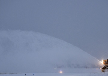 The quiet heroes: 316th CES works round the clock to ensure airfield is clear from snow, ice for Carter state funeral