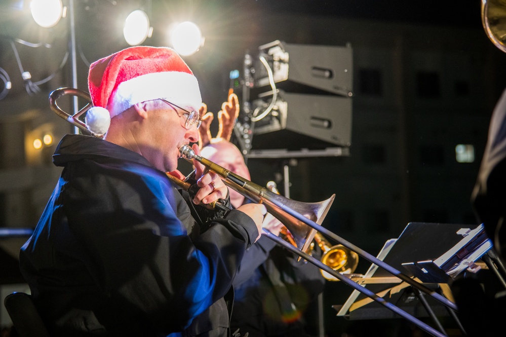 Sailors from the U.S. 7th Fleet Band participate in a Tree-Lighting Ceremony aboard Commander, Fleet Activities Yokosuka.