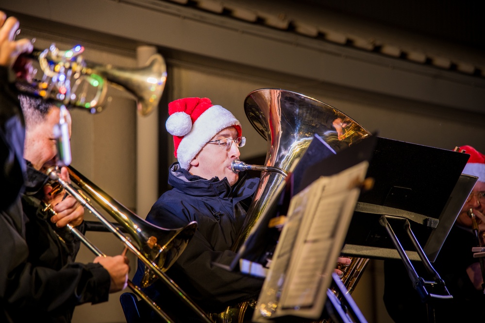 Sailors from the U.S. 7th Fleet Band participate in a Tree-Lighting Ceremony aboard Commander, Fleet Activities Yokosuka.