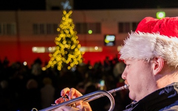 Sailors from the U.S. 7th Fleet Band participate in a Tree-Lighting Ceremony aboard Commander, Fleet Activities Yokosuka.